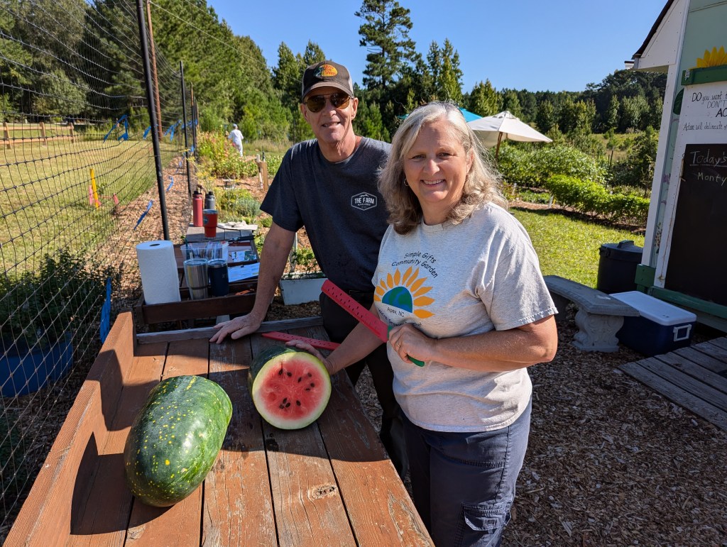 Anne and Chris cutting the watermelon
