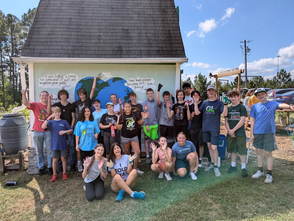 Group photo of kids at the garden