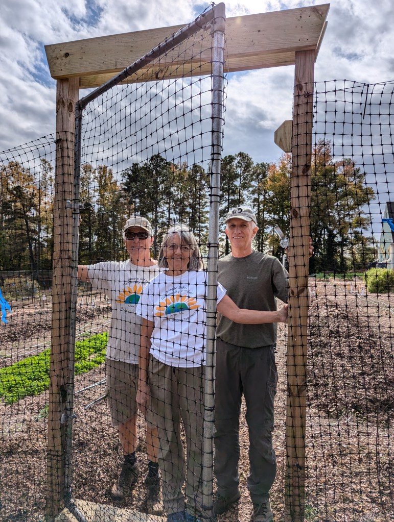 Team standing at the new gate